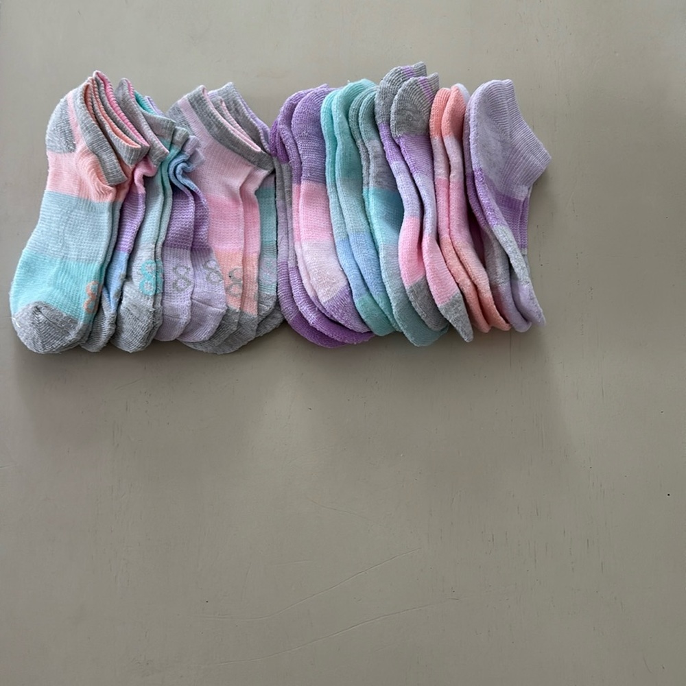 13 pairs of Sox. Brand new. Daughter opened package and they are too small.